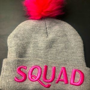 Womens beanie. One size fits all. Grey with bright pink letters: S-Q-U-A-D.